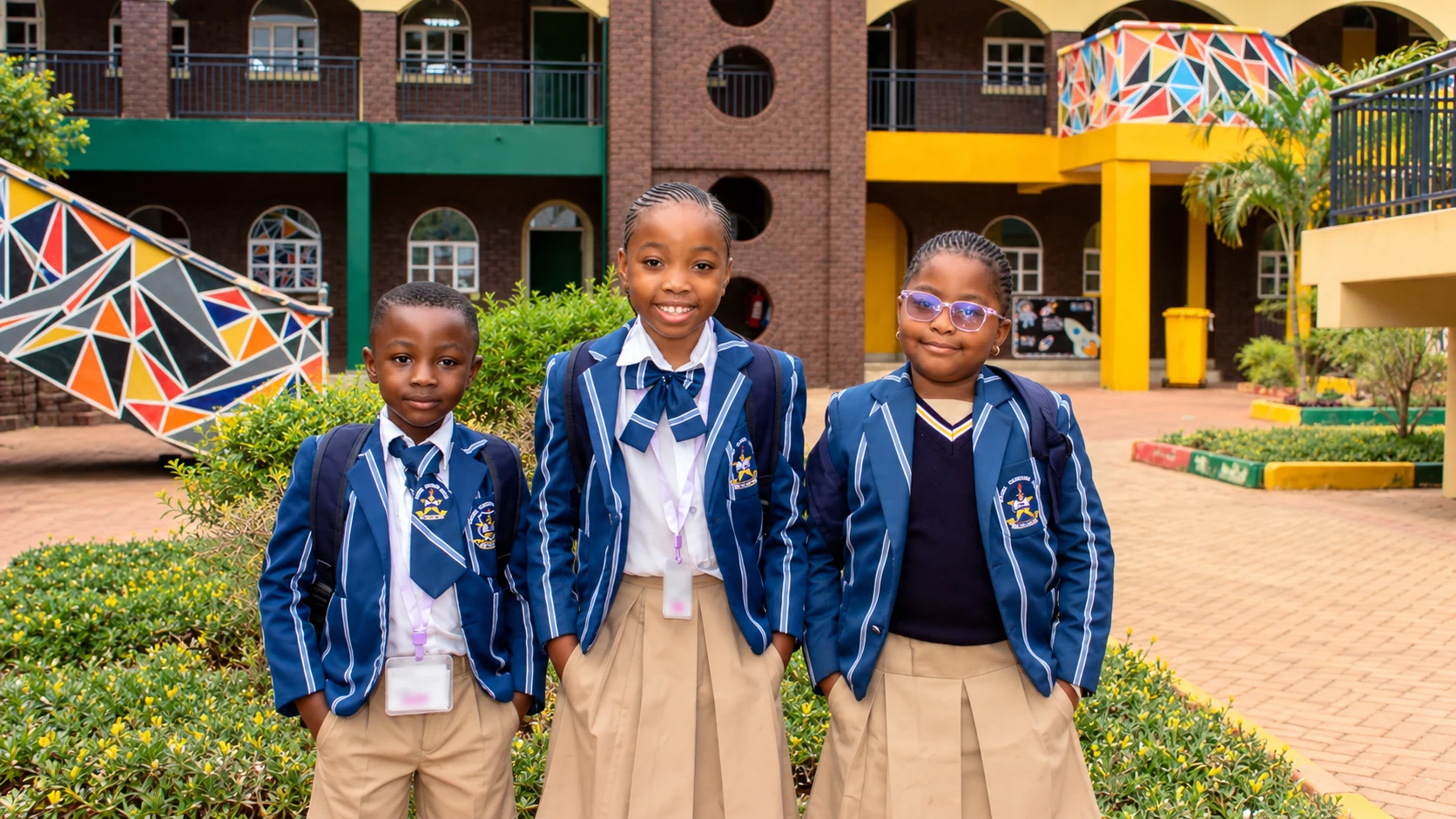 AI-created scene based on the supplied photograph: three students in striped uniforms in their school courtyard